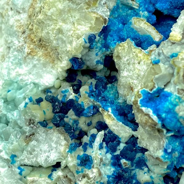 Deep blue veszelyite crystals on a large matrix — alternate view