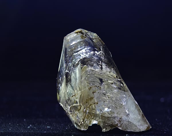 Smoky skeletal quartz with enhydro inclusion from Namibia, close landscape view of layered growth