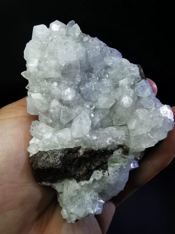Complete front view of pale apophyllite with epidote and garnet