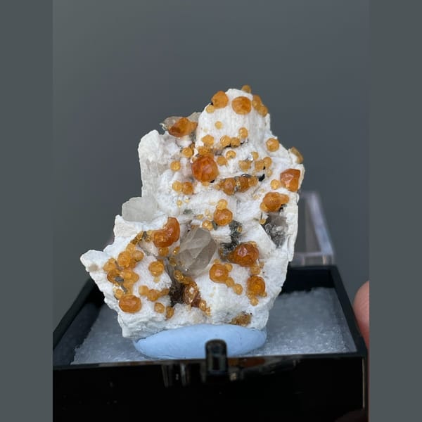 Orange spessartine garnets on feldspar with quartz from Yunxiao, Fujian — complete view