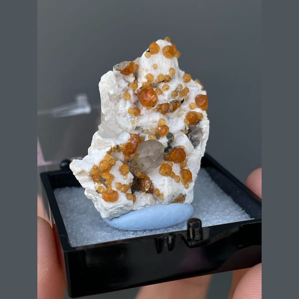 Orange spessartine garnets on feldspar with quartz from Yunxiao, Fujian — alternate view