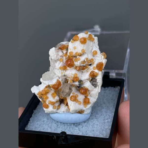 Orange spessartine garnets on feldspar with quartz from Yunxiao, Fujian — alternate view
