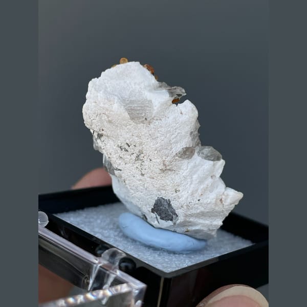 Orange spessartine garnets on feldspar with quartz from Yunxiao, Fujian — detail view