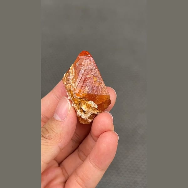 Gemmy orange scheelite crystal from Xuebaoding, Sichuan — complete view