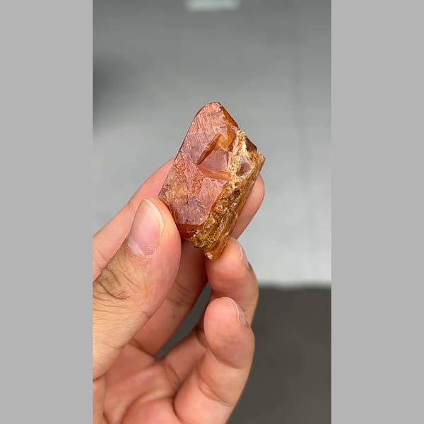 Gemmy orange scheelite crystal from Xuebaoding, Sichuan — detail view