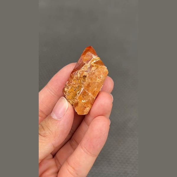 Gemmy orange scheelite crystal from Xuebaoding, Sichuan — detail view