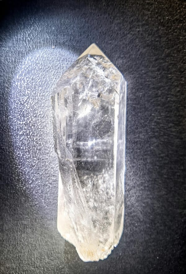 Complete front view of Clear Himalayan Quartz Point with Golden Inclusions from Pakistan