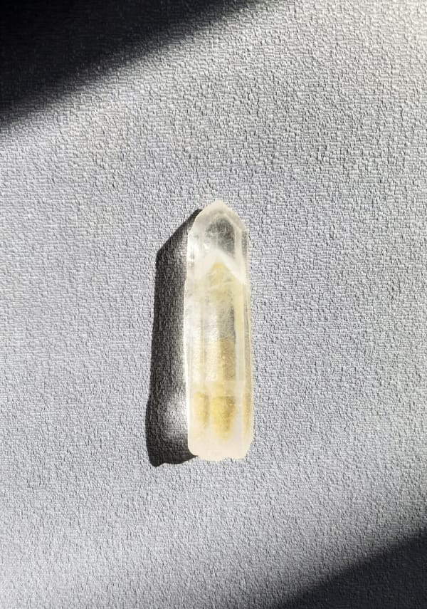 Slim Himalayan Phantom Quartz Point — Pakistan — individual mineral specimen view 1