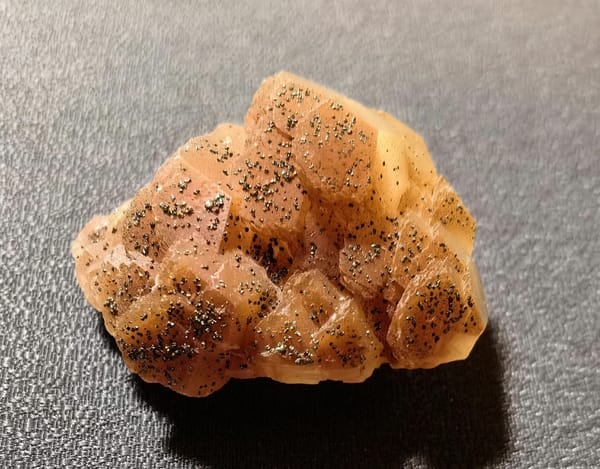 Coin-Stack Calcite Tower with Pyrite — Daye — individual mineral specimen view 1