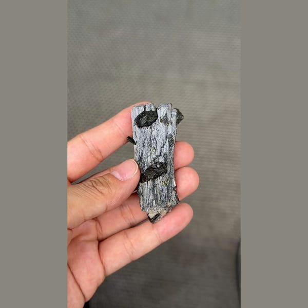 Long dark lustrous epidote crystals with white zeolite — alternate view