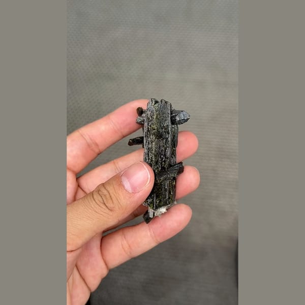 Long dark lustrous epidote crystals with white zeolite — alternate view