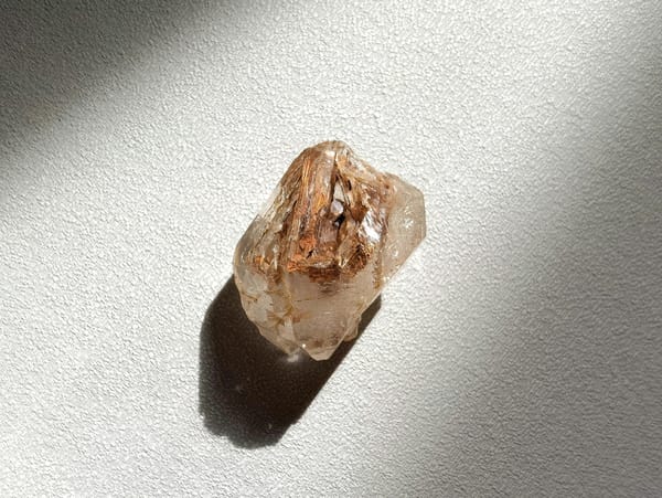 Double-Terminated Red-Clay Skeletal Quartz — Madagascar — individual mineral specimen view 1