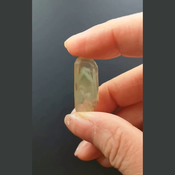 Pale green phantom quartz point from Madagascar — complete view
