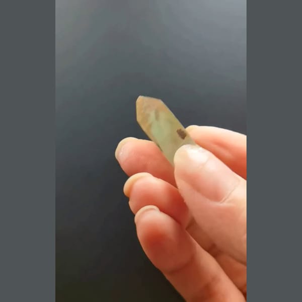Pale green phantom quartz point from Madagascar — alternate view