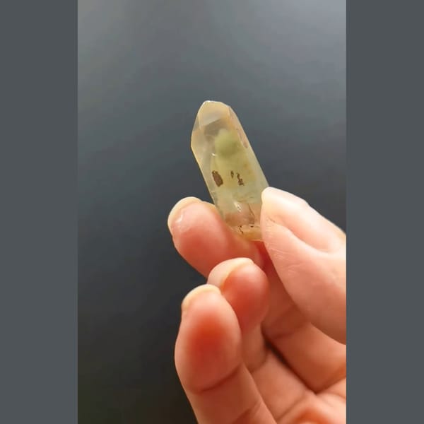 Pale green phantom quartz point from Madagascar — detail view