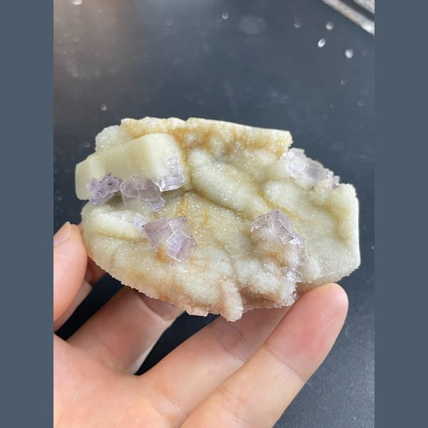 Lilac-purple fluorite cubes on white quartz from Guizhou — alternate view