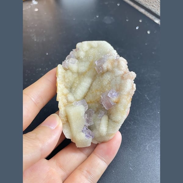 Lilac-purple fluorite cubes on white quartz from Guizhou — alternate view