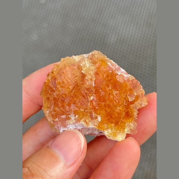 Amber-orange fluorite cluster from Henan — complete view