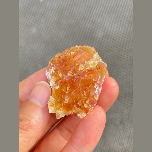 Amber-orange fluorite cluster from Henan — alternate view