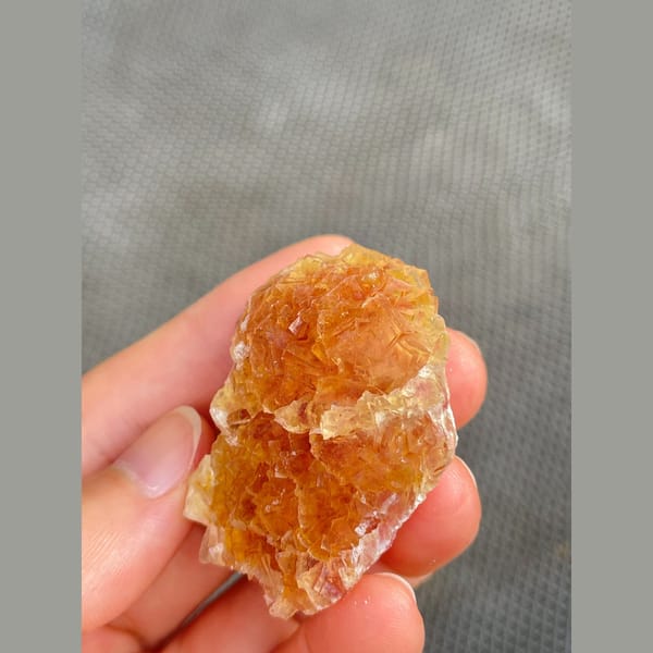Amber-orange fluorite cluster from Henan — detail view