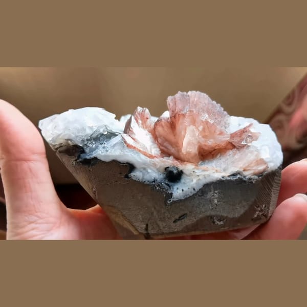 Clear apophyllite with peach red stilbite from India — alternate view
