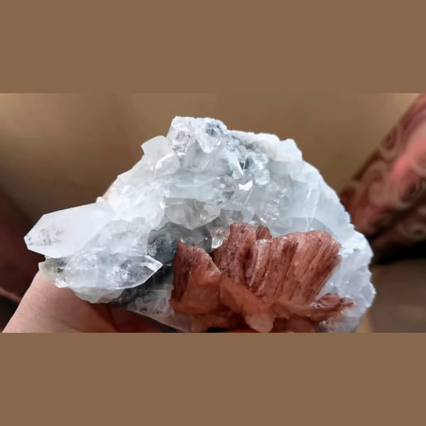 Clear apophyllite with peach red stilbite from India — detail view