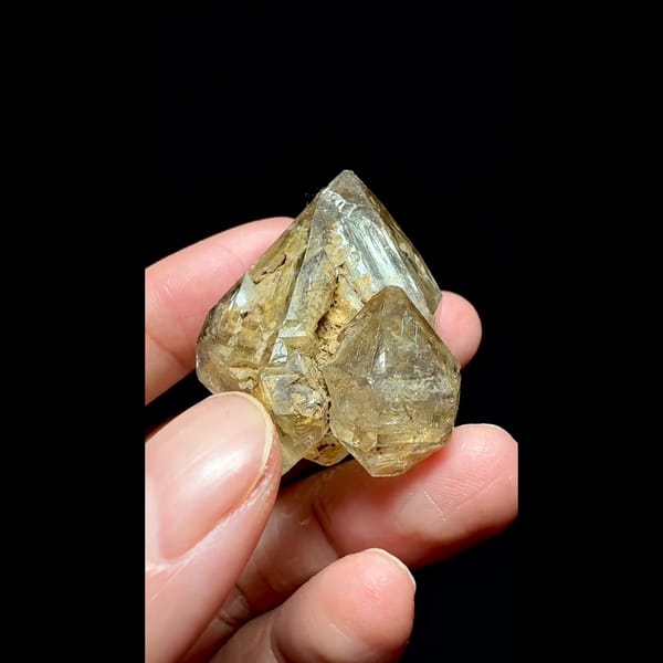 Yellow clay skeletal quartz point from Pakistan — complete view