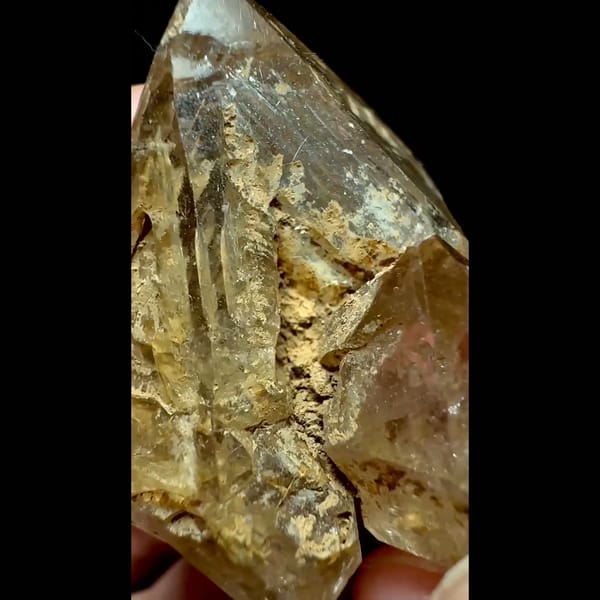 Yellow clay skeletal quartz point from Pakistan — detail view