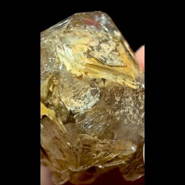 Yellow clay skeletal quartz point from Pakistan — detail view