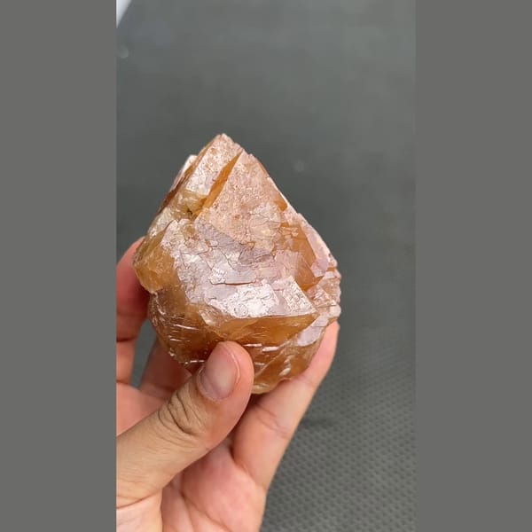 Large 7 cm orange scheelite crystal from Xuebaoding, Sichuan — alternate view
