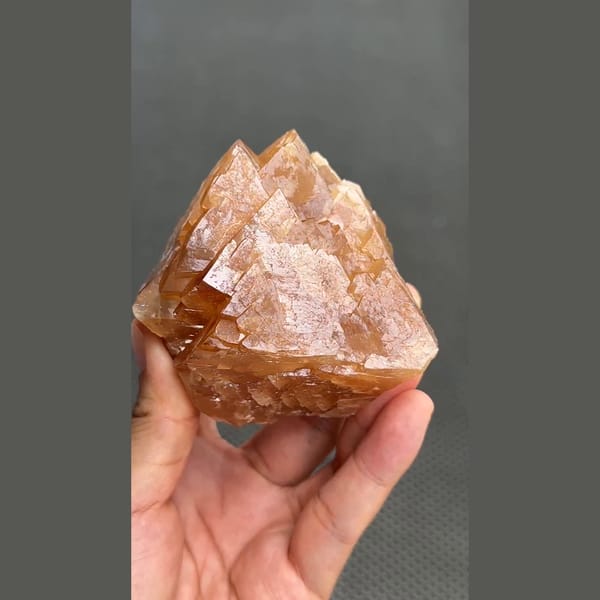 Large 7 cm orange scheelite crystal from Xuebaoding, Sichuan — alternate view