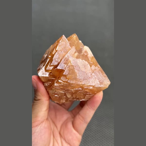 Large 7 cm orange scheelite crystal from Xuebaoding, Sichuan — detail view