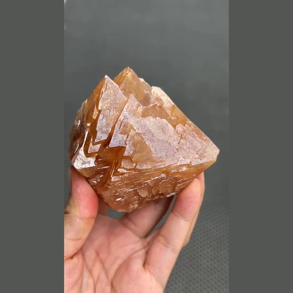 Large 7 cm orange scheelite crystal from Xuebaoding, Sichuan — detail view