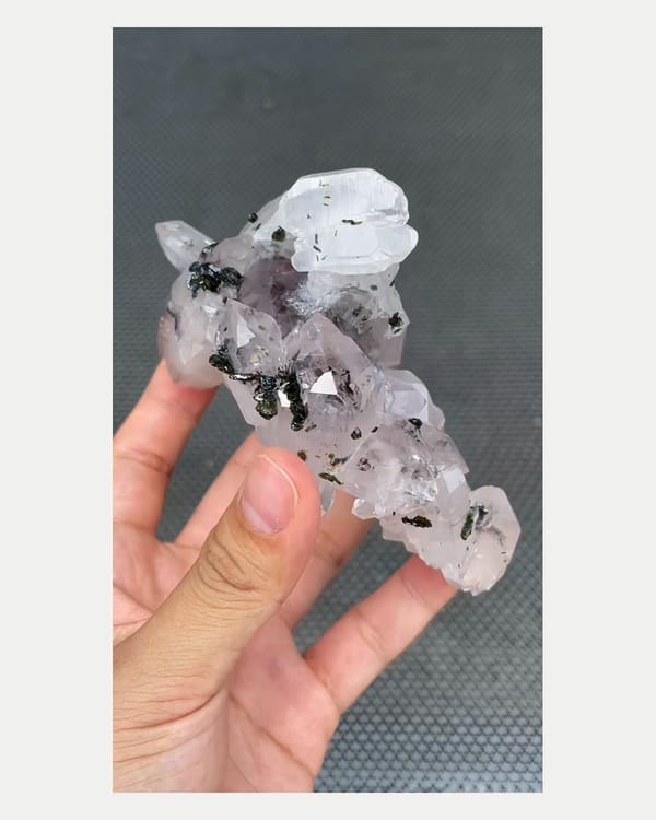 Complete right oblique view of garden quartz crystal cluster