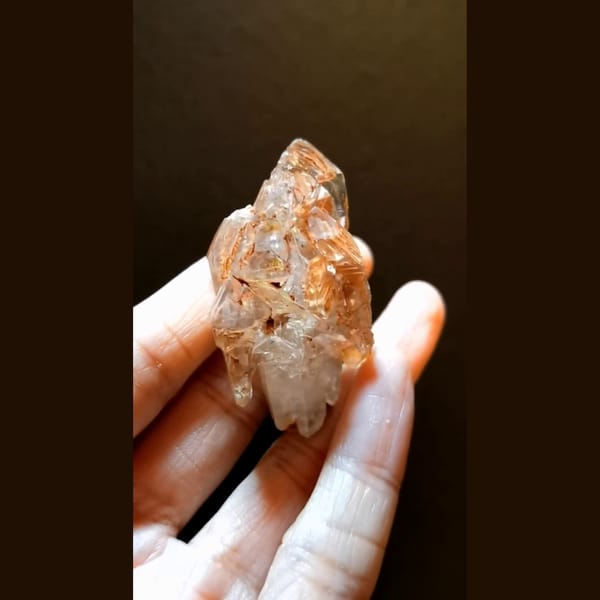 Red clay skeletal quartz with UV from Madagascar — complete view