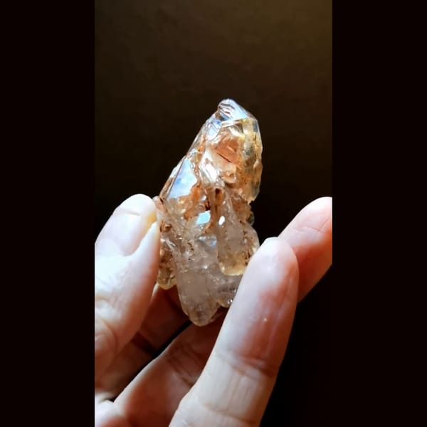 Red clay skeletal quartz with UV from Madagascar — alternate view