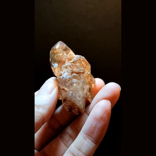 Red clay skeletal quartz with UV from Madagascar — alternate view