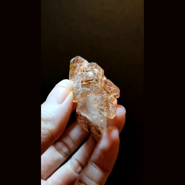 Red clay skeletal quartz with UV from Madagascar — detail view