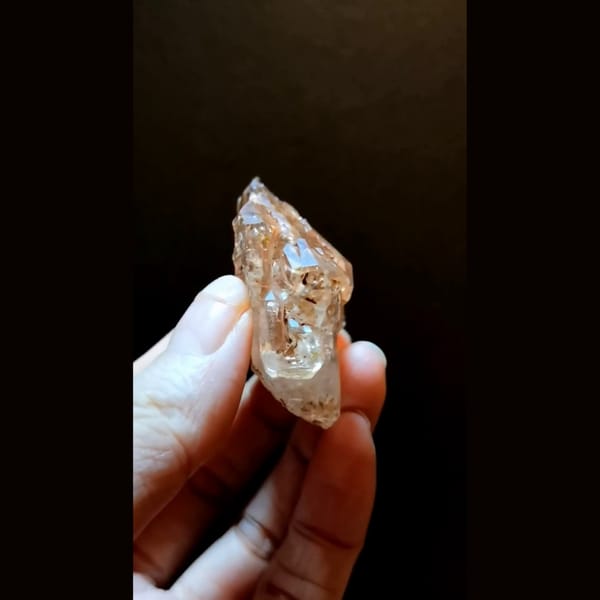 Red clay skeletal quartz with UV from Madagascar — detail view