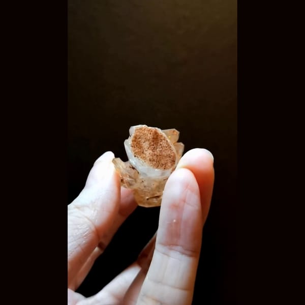 Red clay skeletal quartz with UV from Madagascar — detail view