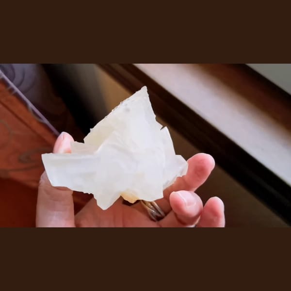 Pale yellow calcite crystals from Yunnan — complete view