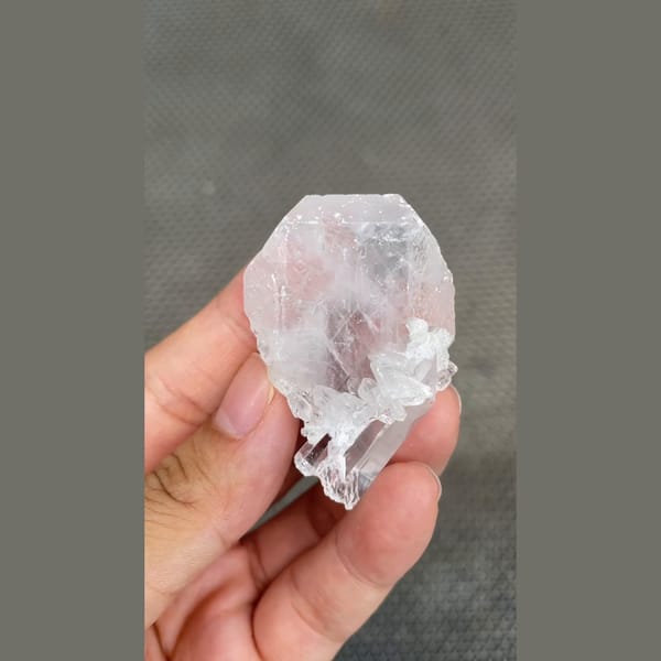 Clear glassy barite crystal with quartz from Jinkouhe, Sichuan — detail view
