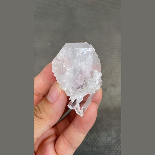 Clear glassy barite crystal with quartz from Jinkouhe, Sichuan — detail view