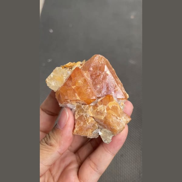 Chunky orange scheelite crystal on matrix from Xuebaoding, Sichuan — alternate view