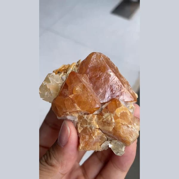 Chunky orange scheelite crystal on matrix from Xuebaoding, Sichuan — alternate view