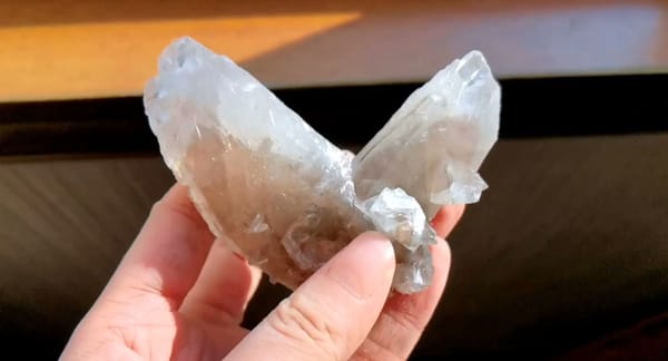 Complete side view of the exact Twinned Swallowtail Calcite from Daye