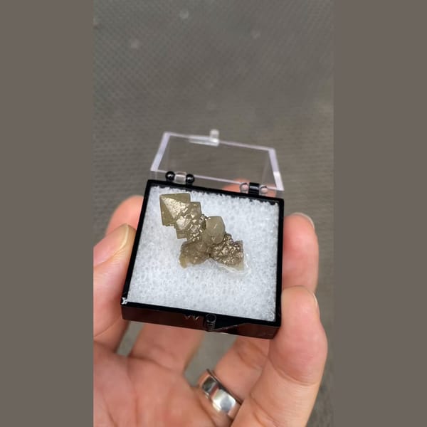 Small screw quartz crystal in display box from Inner Mongolia — alternate view