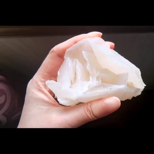 Pale pink rose petal calcite from Hunan — detail view