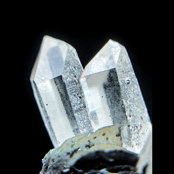 Clear quartz points with black bladed specular hematite from Guangdong — detail view