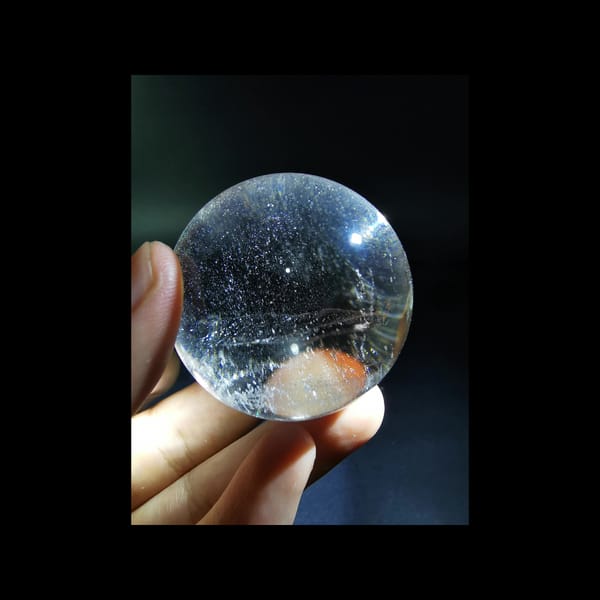 Starry clear quartz sphere, 43.5 mm — detail view